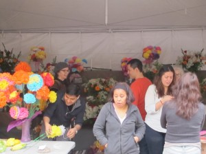 neighbors build altar at St. Mark's church for Dia de los Muertos.