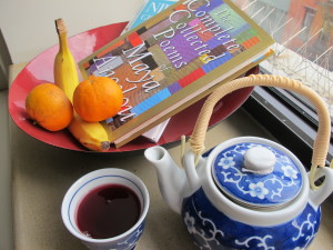 food and poetry books with tea and fruit basket